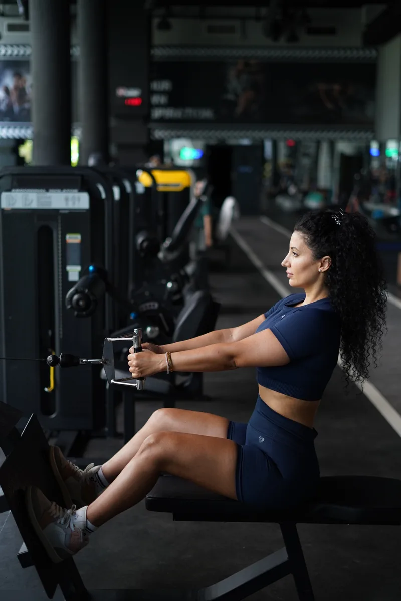 Ceece using the seated cable row machine